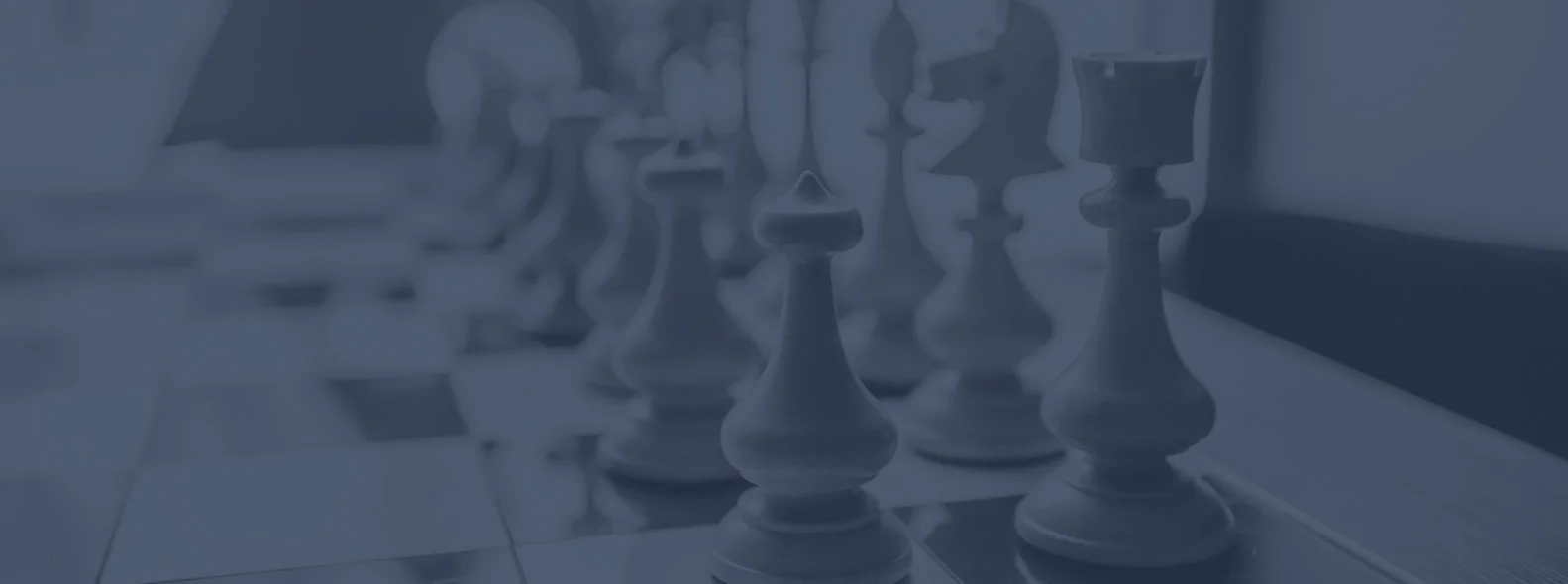 Chess pieces on a board representing containing costs for daily operations with due diligence services